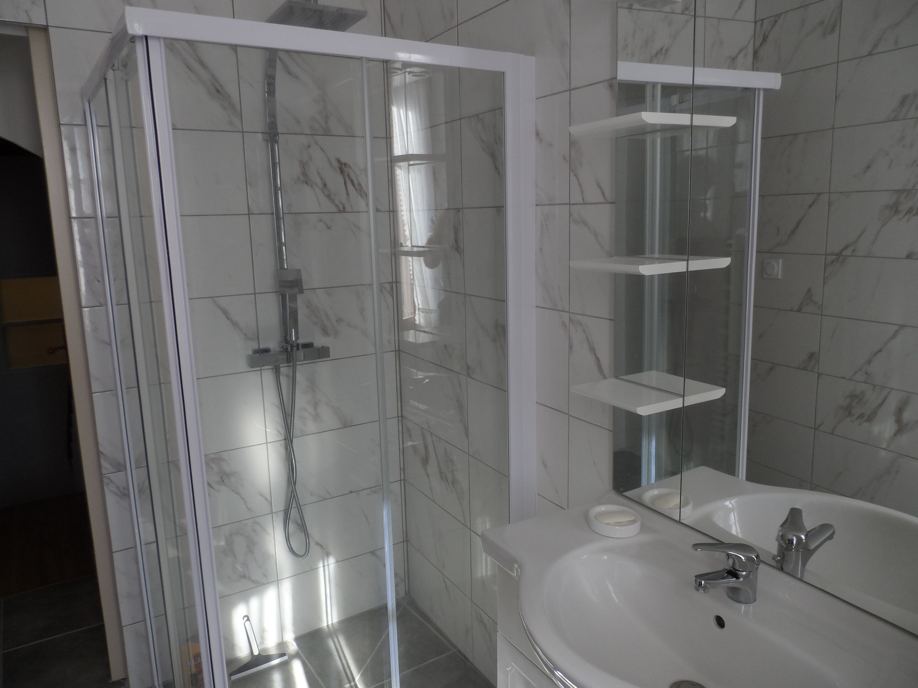 Combined shower/tub, hair dryer, towels, soap