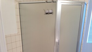 A bathroom with a bathtub, a shower, and tiled flooring. - Beautiful 2 Bedroom Luxury Loft in the heart of Aurora (Aurora)