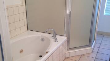 Jetted tub, hair dryer, towels, soap