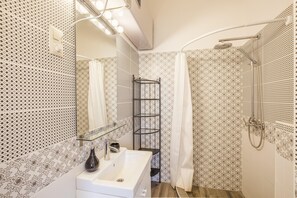 Hair dryer, slippers, towels, toilet paper