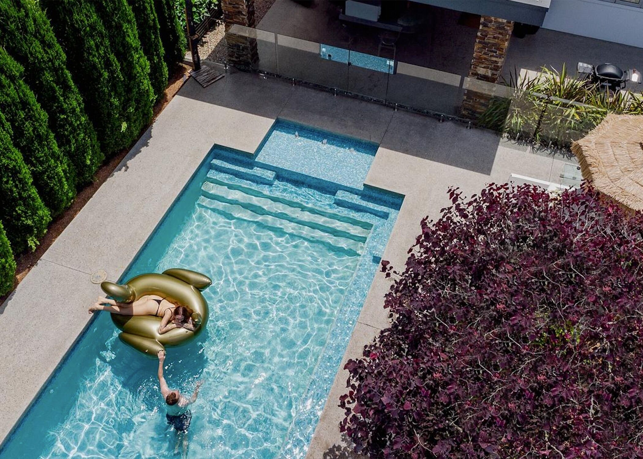 A heated pool, pool loungers