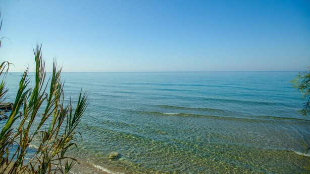 A clear view of a beach with calm water and clear skies. - Dione, Modern Private Villa With Swimming Pool (Corfu)