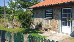 A stone house with a red-tiled roof, a white door, and a small window. - Nature in its purest state ... (Casais de Vide)