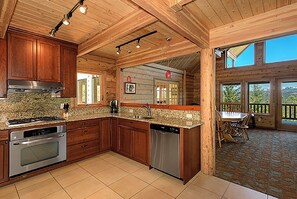 Enjoy cooking in the well-equipped kitchen with a stove, oven, and dishwasher. Dine al fresco on the adjacent deck.