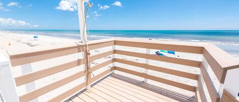 On the beach, sun loungers, beach towels