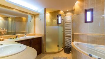 Combined shower/bathtub, hair dryer, bathrobes, towels