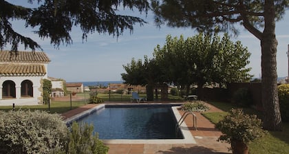 Rustic farmhouse with sea views, large garden and private pool.