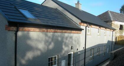 43 Templemoyle-maalaismökkiä