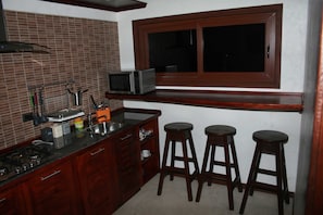 Fridge, microwave, stovetop, coffee/tea maker