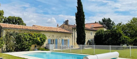 A heated pool, pool loungers