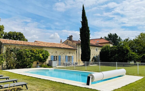 A heated pool, pool loungers