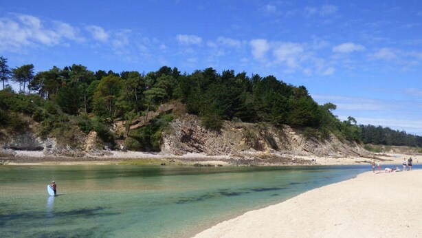 A beach with clear water, sandy shore, and a forested hillside. - Villa Celtitude - Villas of Sands  (Plurien)