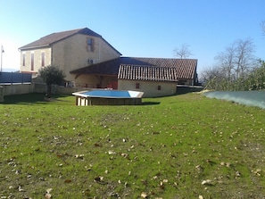 A house with a swimming pool in the yard.