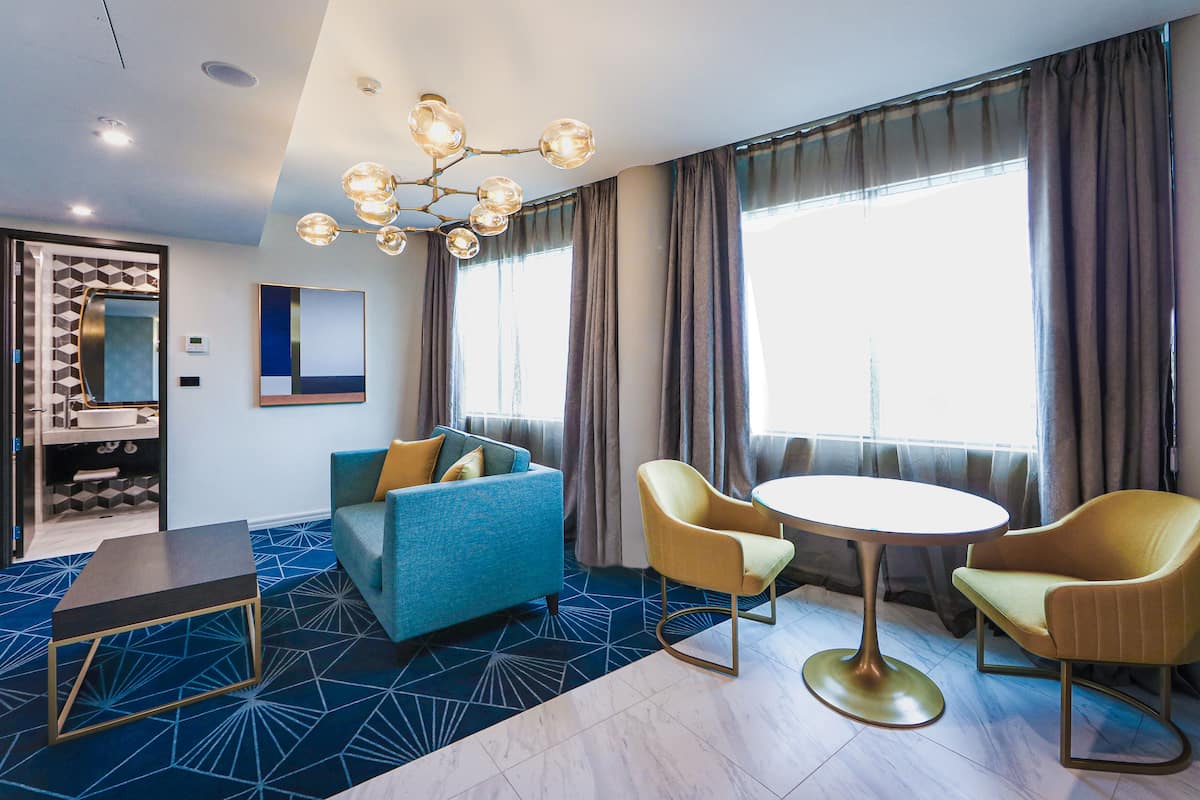 Swiss-SuperSuite One Bedroom | Living area | Flat-screen TV