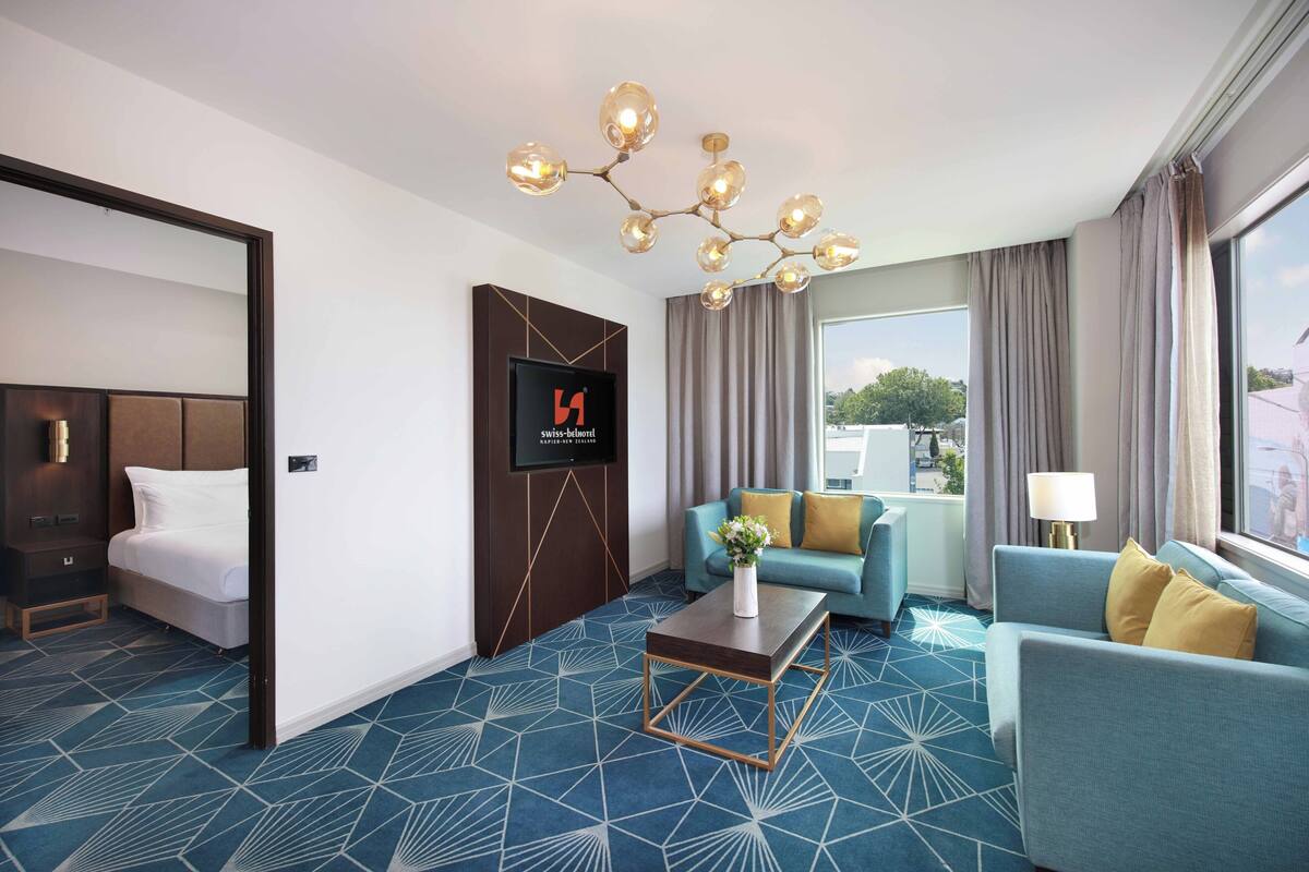 Swiss-SuperSuite One Bedroom | Living area | Flat-screen TV