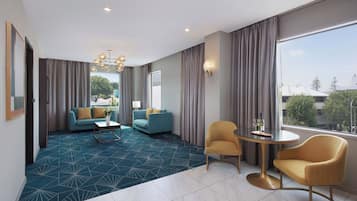 Swiss-SuperSuite One Bedroom | Living area | Flat-screen TV