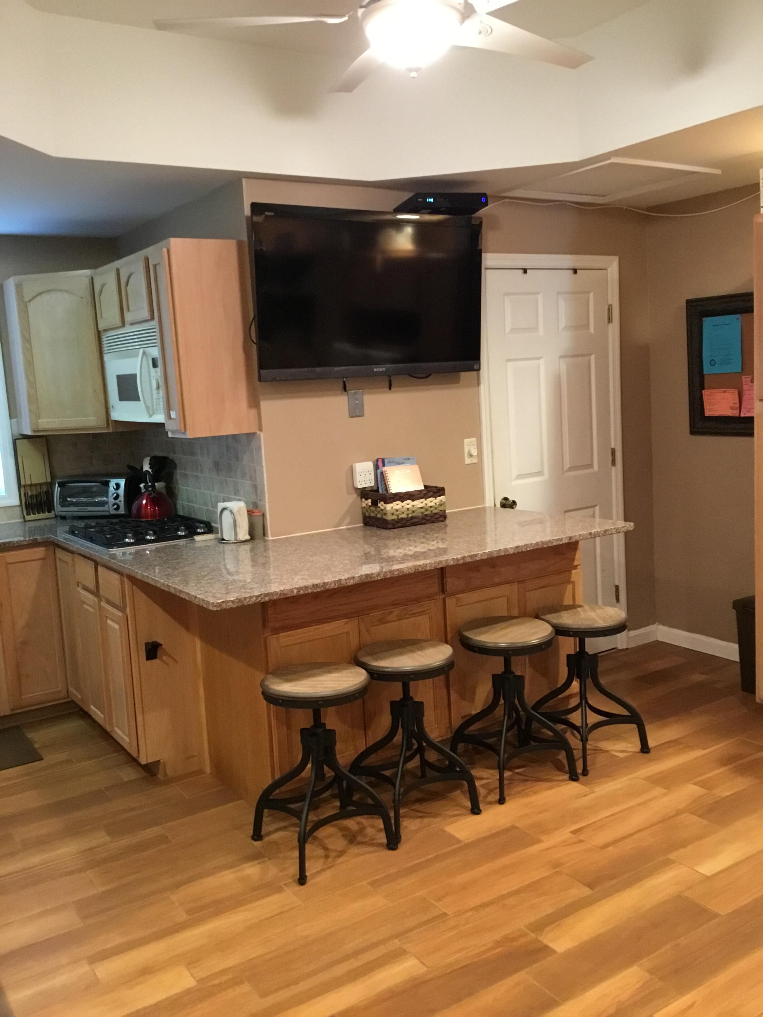 ENJOY YOUR FAVORITE BEVERAGE FEELING THE OCEAN BREEZE ON THE LARGE PORCH