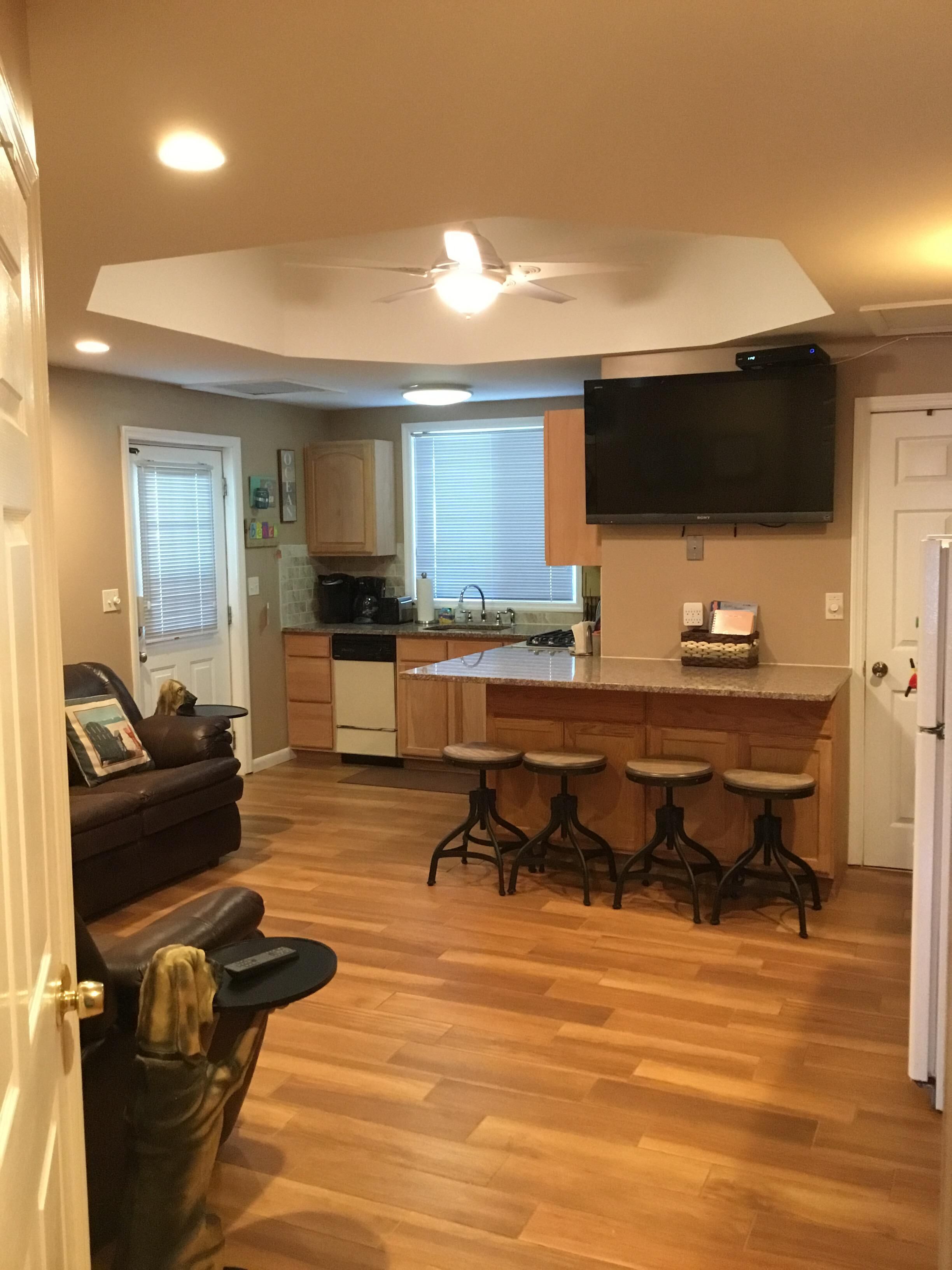 ENJOY YOUR FAVORITE BEVERAGE FEELING THE OCEAN BREEZE ON THE LARGE PORCH