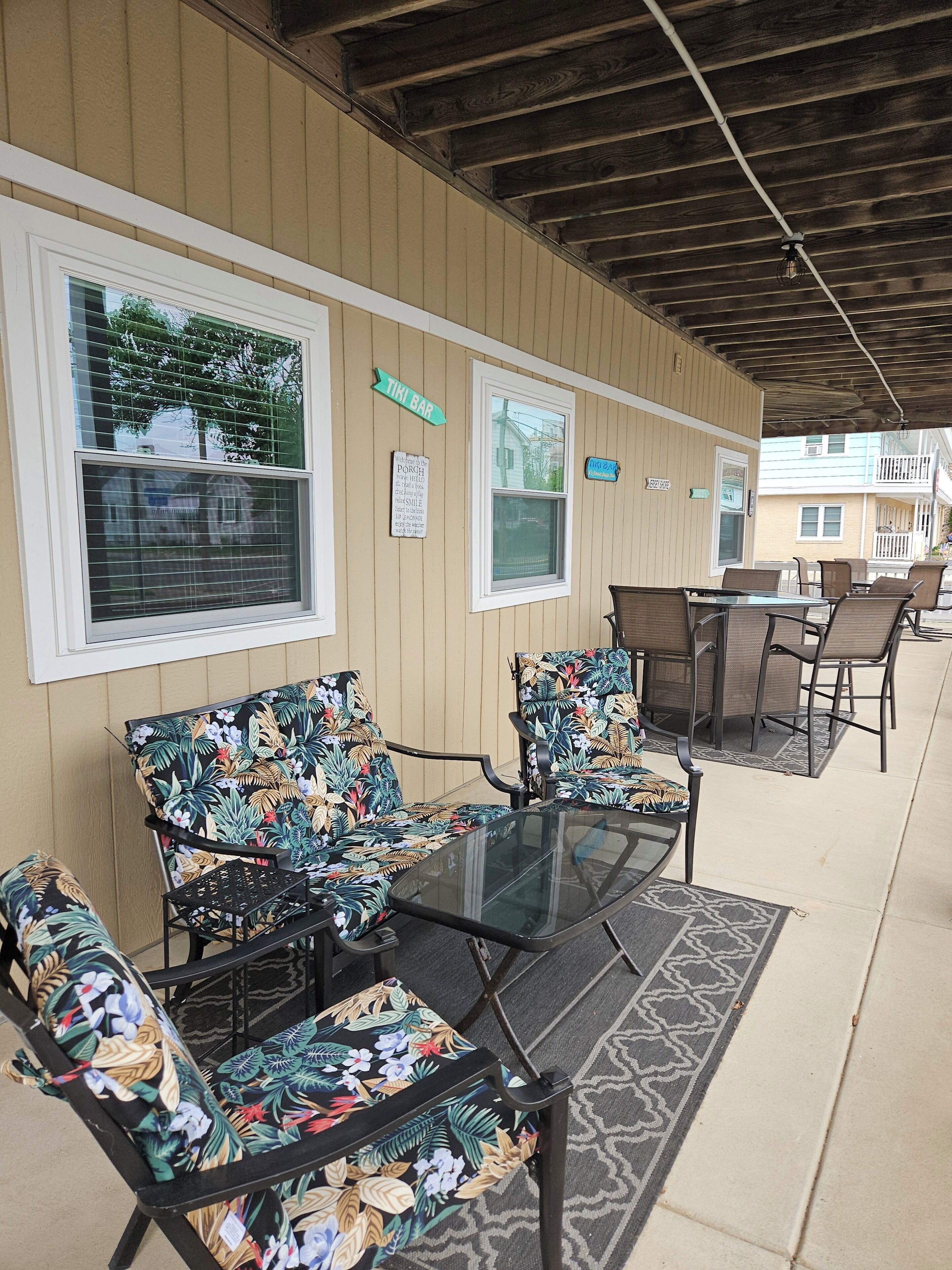 ENJOY YOUR FAVORITE BEVERAGE FEELING THE OCEAN BREEZE ON THE LARGE PORCH