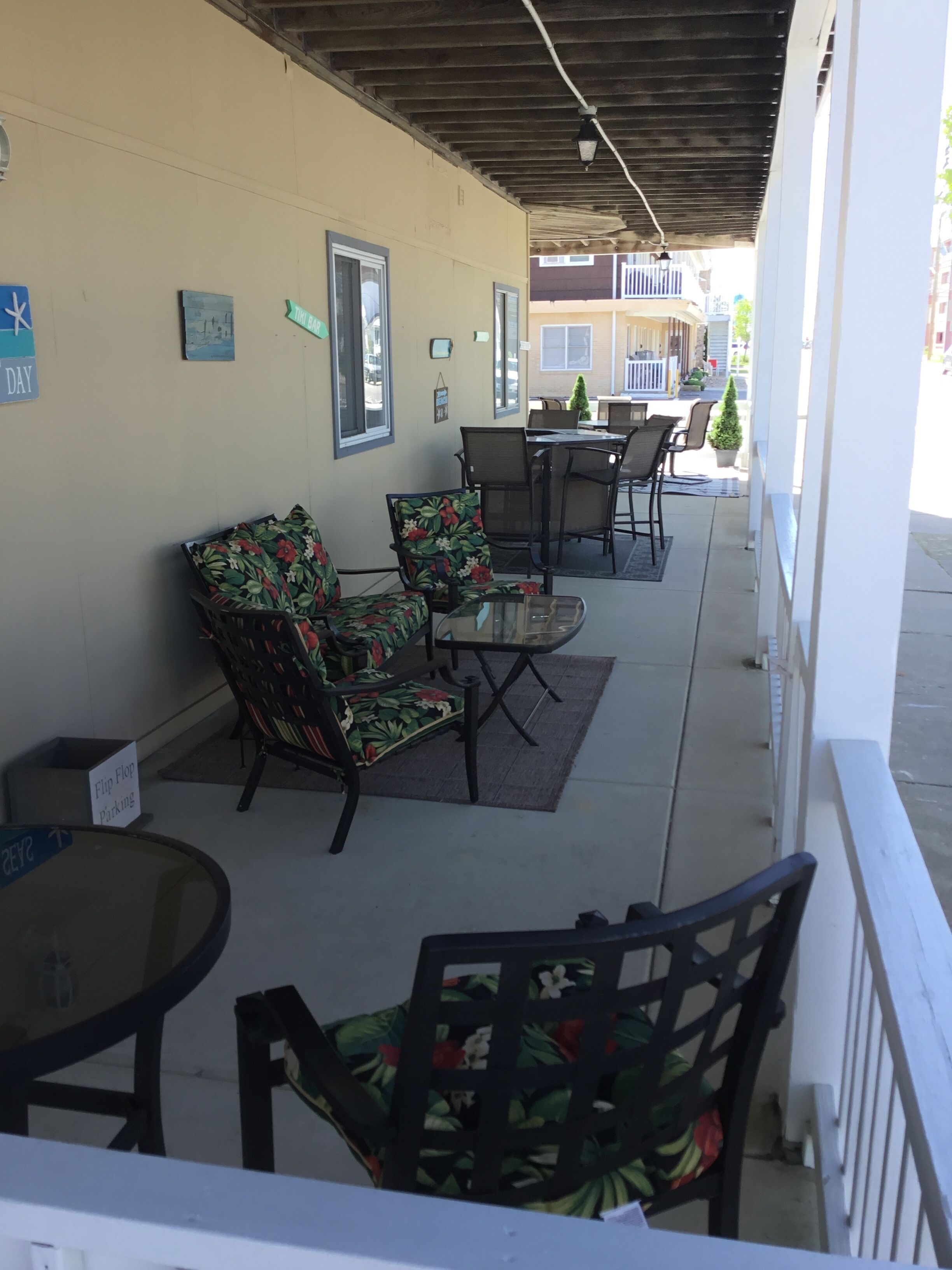 ENJOY YOUR FAVORITE BEVERAGE FEELING THE OCEAN BREEZE ON THE LARGE PORCH