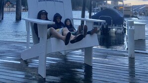 A wooden dock with a white chair featuring a logo and website. - Best Place / Best Condition / Best Price !!! Go to everything !!! (coeur d alene)