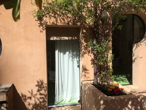 Step into a serene oasis with a doorway leading to a peaceful interior space.