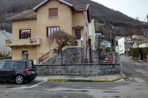 Outside of the House . Garden entrance to the left, garage entrance to the right