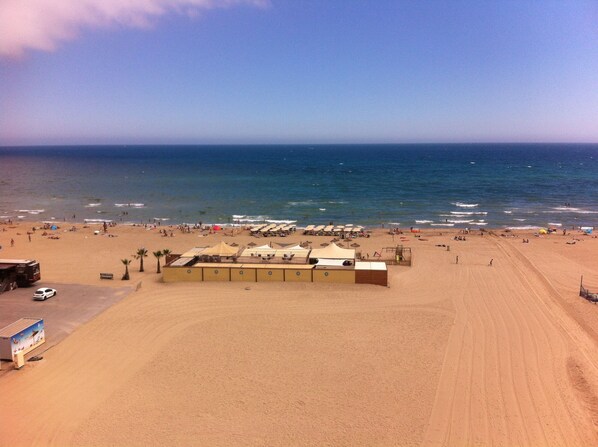 Relax on the beach with stunning ocean views and comfortable sun loungers.