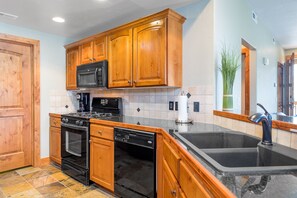 Fridge, microwave, oven, stovetop - Bright luxury quiet 2nd floor 2/2 condo with fireplace, deck, and sunset views (Park City)