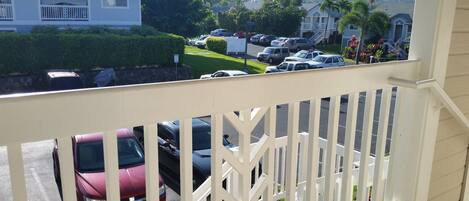 A residential area with a view of parked cars and houses.