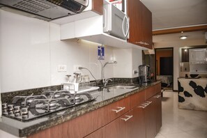 Fridge, microwave, stovetop, coffee/tea maker