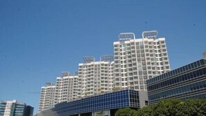 A high-rise building with multiple balconies and a modern architectural design. - Mactan Newtown by Javadrea (Lapu-Lapu)
