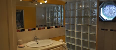 Shower, hair dryer, towels, soap