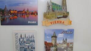 Four cityscape postcards: Dresden, Vienna, Copenhagen, and Prague.
