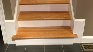 A staircase with wooden steps and white walls. - Contemporary East Side Townhouse (Providence)