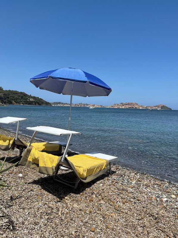 On the beach, sun loungers