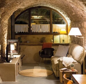 Relax in this inviting room with a sofa, side table, and comfortable chair.