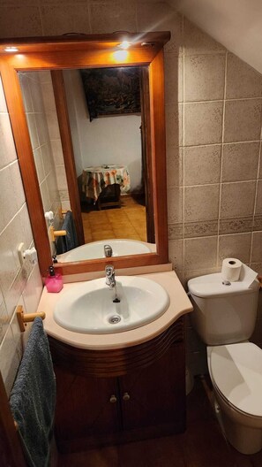 Combined shower/tub, hair dryer, towels, soap