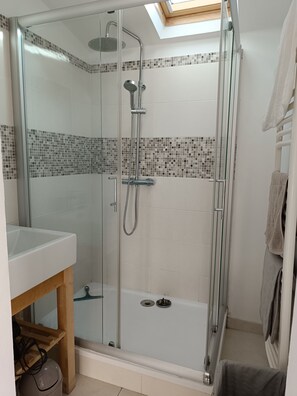 Bathtub, hair dryer, soap, toilet paper