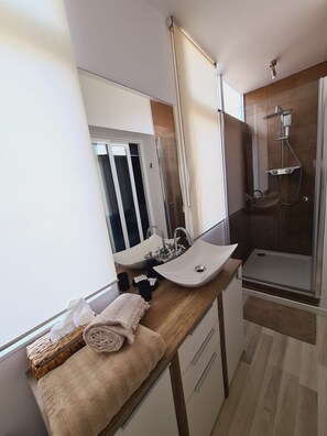 Shower, hair dryer, towels, soap