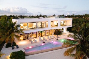 A heated pool, sun loungers