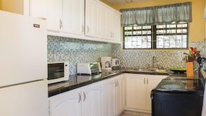 Fridge, stovetop, dining tables