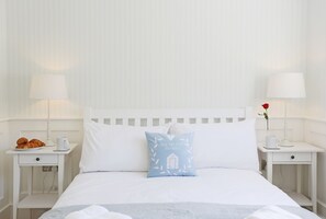 1 bedroom, desk, iron/ironing board, travel crib
