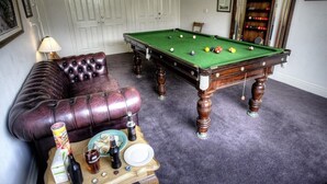 A pool table with balls, a leather sofa, and a small table with drinks and snacks. - Luxury Accessible Garden Retreat Near Beaches, Golf & Wineries (Point Lonsdale)