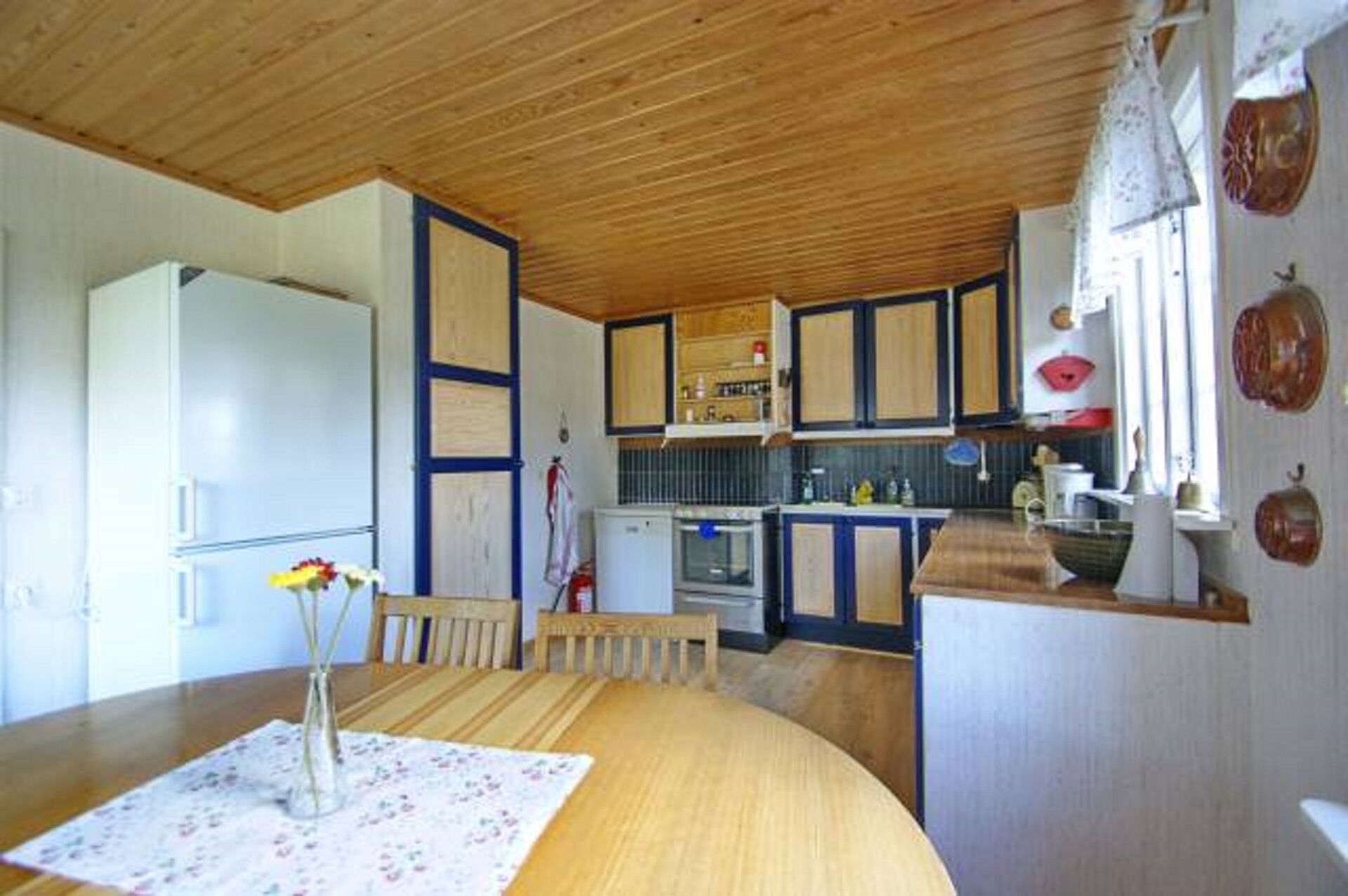 Cottage by the lake with private dock, boat, sauna and large garden with barbecue area