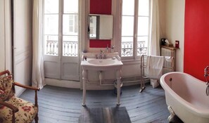 Bathtub, hair dryer, towels, soap