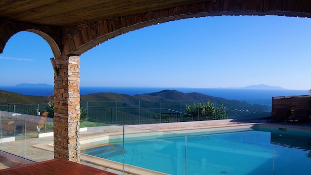 A pool with a clear view of the mountains in the background. - LARGE VILLA - 4 **** - HEATED SWIMMING POOL, 180° SEA VIEW - AIR CONDITIONED 
 (Sisco)