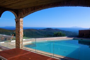 A pool with a clear view of the mountains in the background.