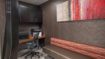 A modern office space with a desk, computer, and office chair.