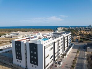 Exterior - Modern Condo 2BR with Rooftop Pool Ocean Views  10 Min Walk to Medano Beach and (cabo san lucas)